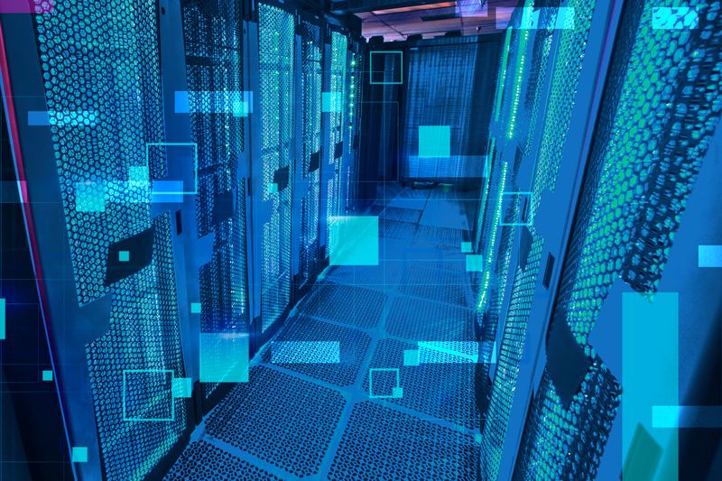 High-density fibre patching on a GPU cluster switch — colour-sorted aqua jumpers, each labelled